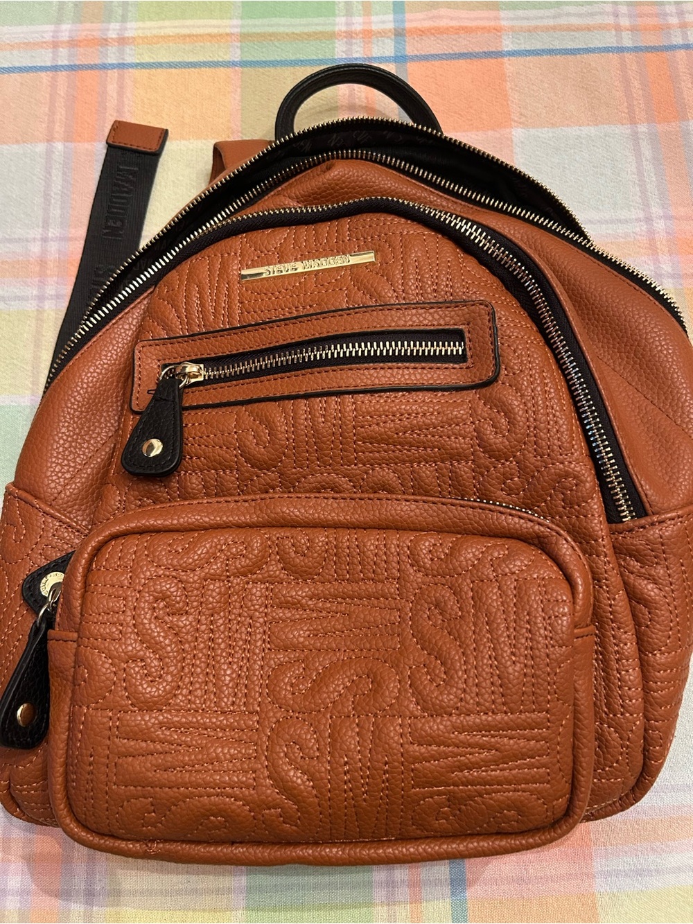 Steve Madden Cognac Quilted Mini Backpack. New without tags. 3 outside pockets